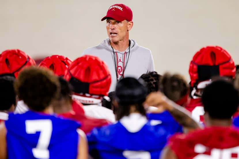 FILE - Oklahoma coach Brent Venables talks to players during the NCAA college football...