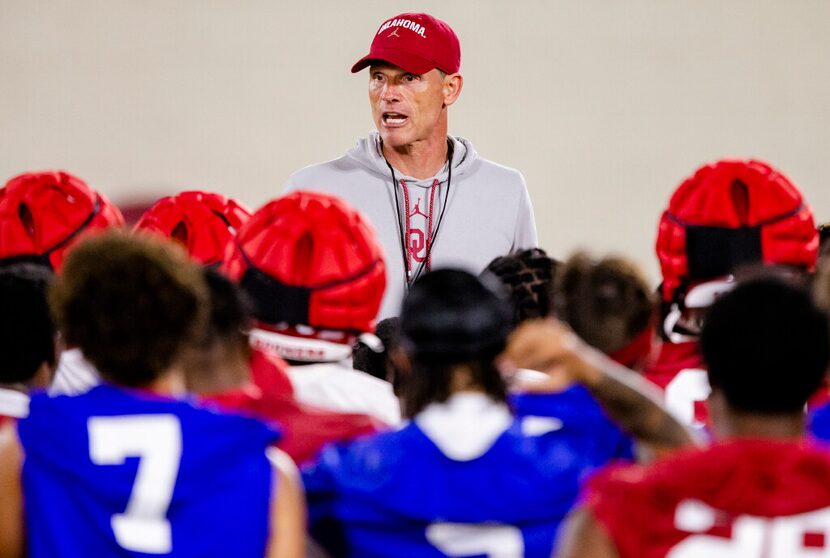 FILE - Oklahoma coach Brent Venables talks to players during the NCAA college football...