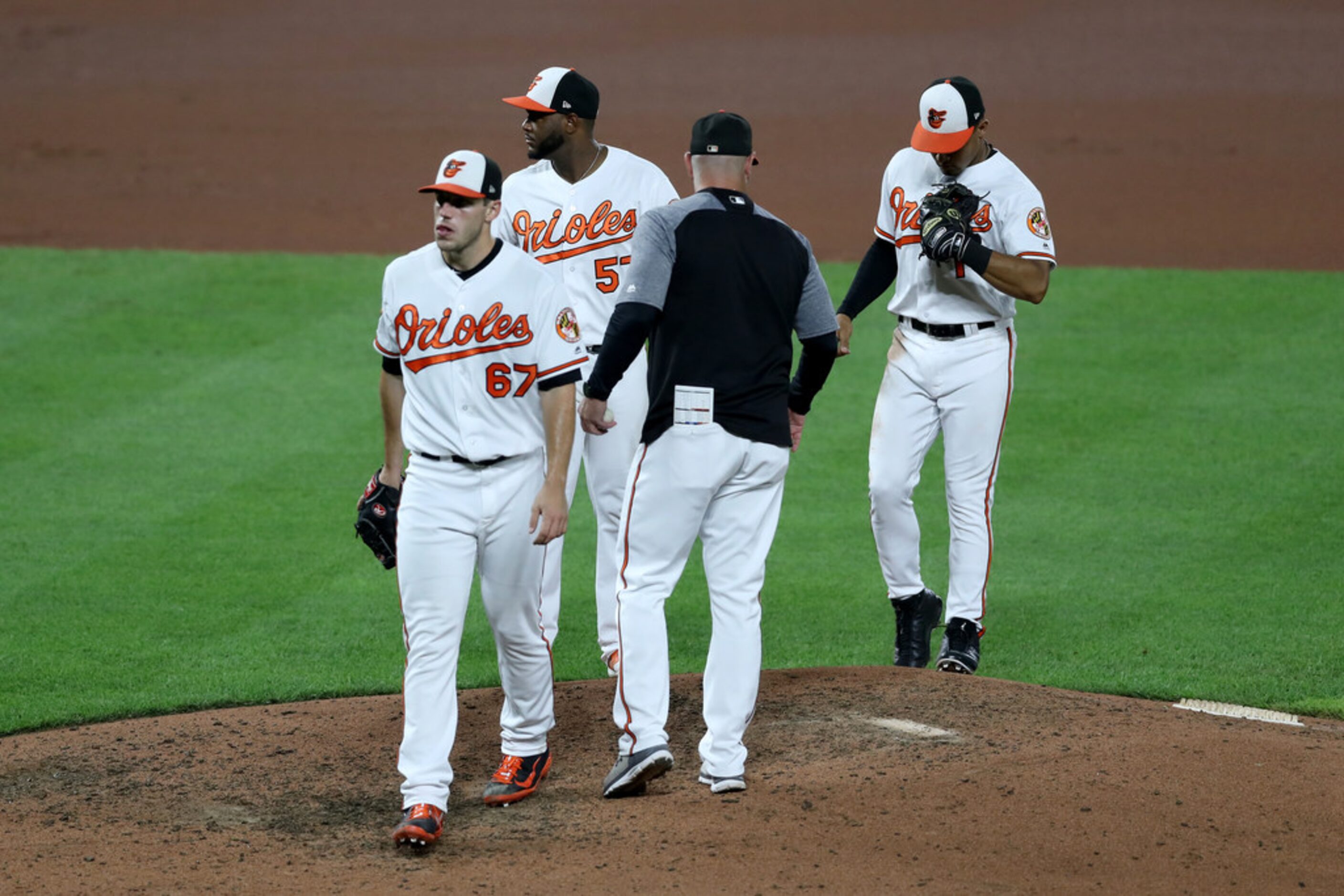 BALTIMORE, MARYLAND - SEPTEMBER 05: John Means #67 of the Baltimore Orioles leaves the game...