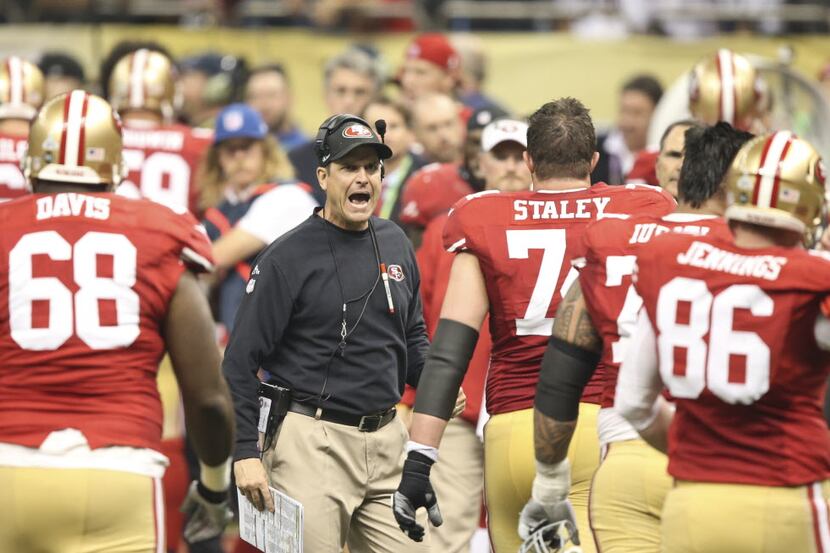 San Francisco 49ers head coach Jim Harbaugh yells to his team in Super Bowl XLVII at the...