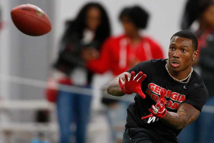 Georgia wide receiver Mecole Hardman (4) reaches for a pass during Pro Day at the University...