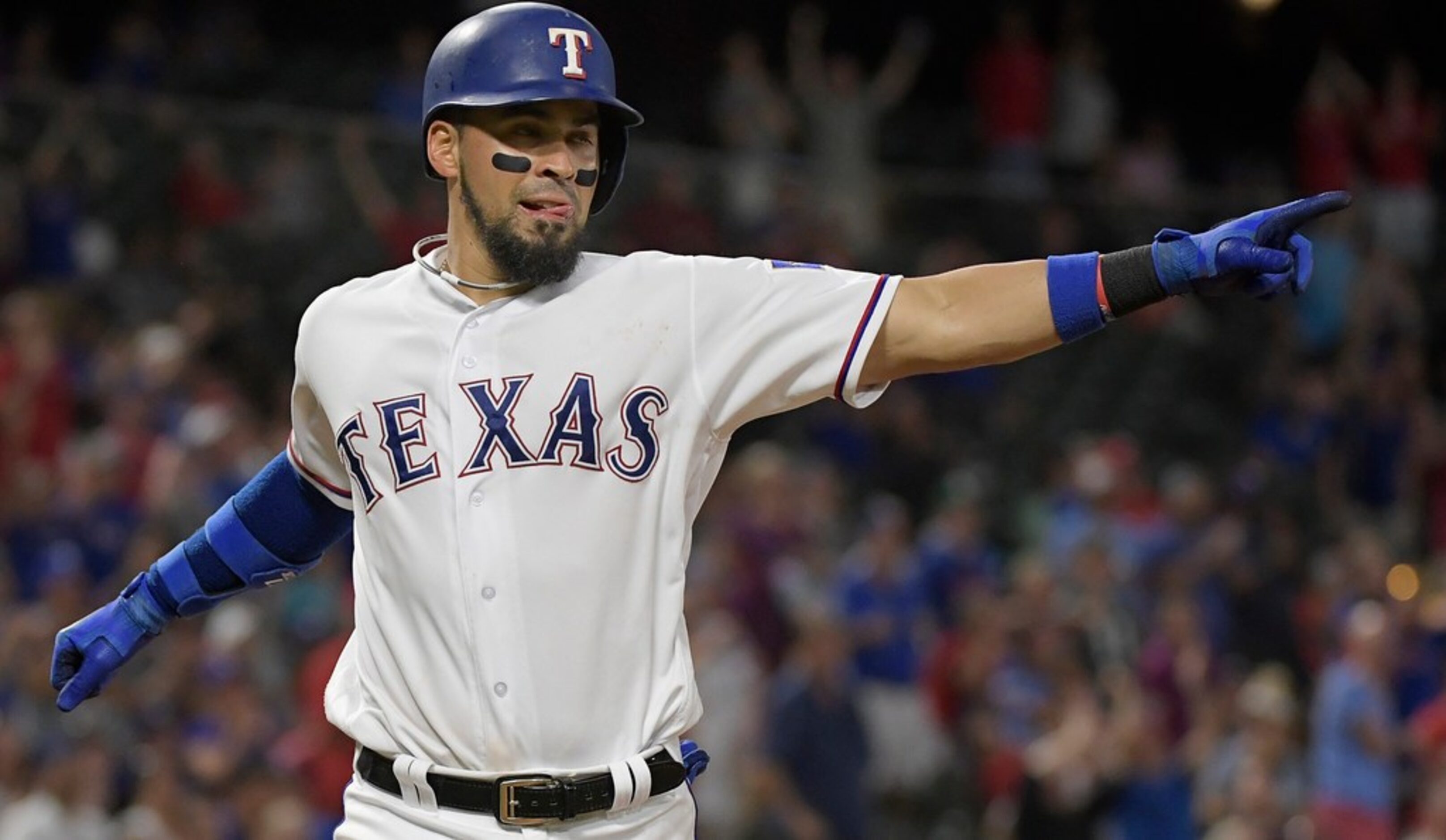 Texas Rangers catcher Robinson Chirinos (61) scores a run on a center fielder Delino...