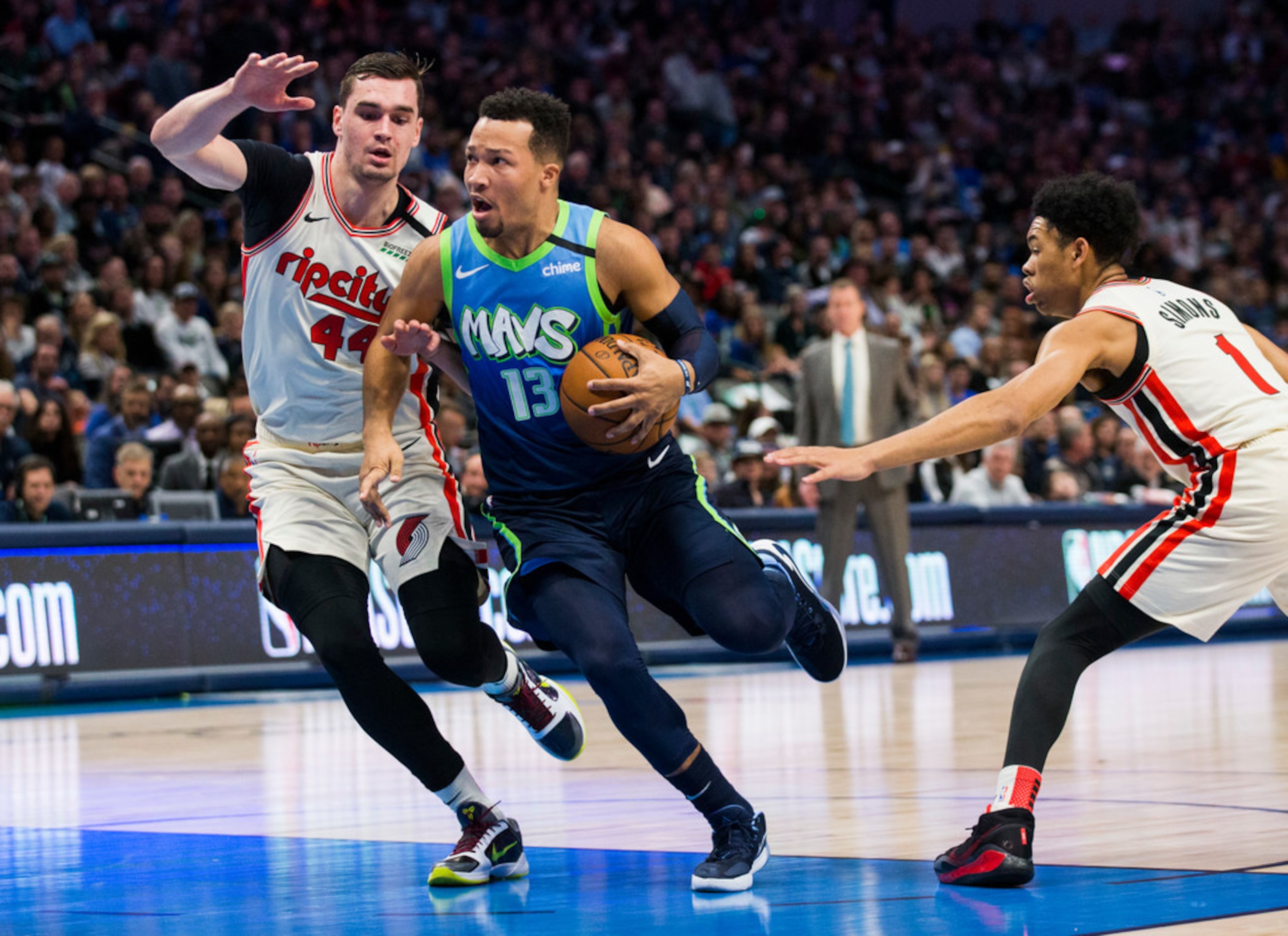 Dallas Mavericks guard Jalen Brunson (13) pushes his way past Portland Trail Blazers forward...