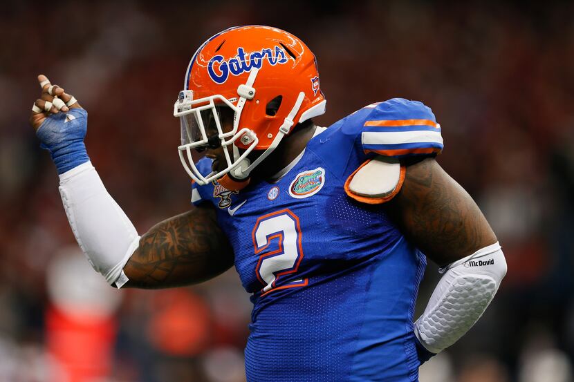 Dominique Easley #2 of the Florida Gators celebrates after sacking Teddy Bridgewater #5 of...