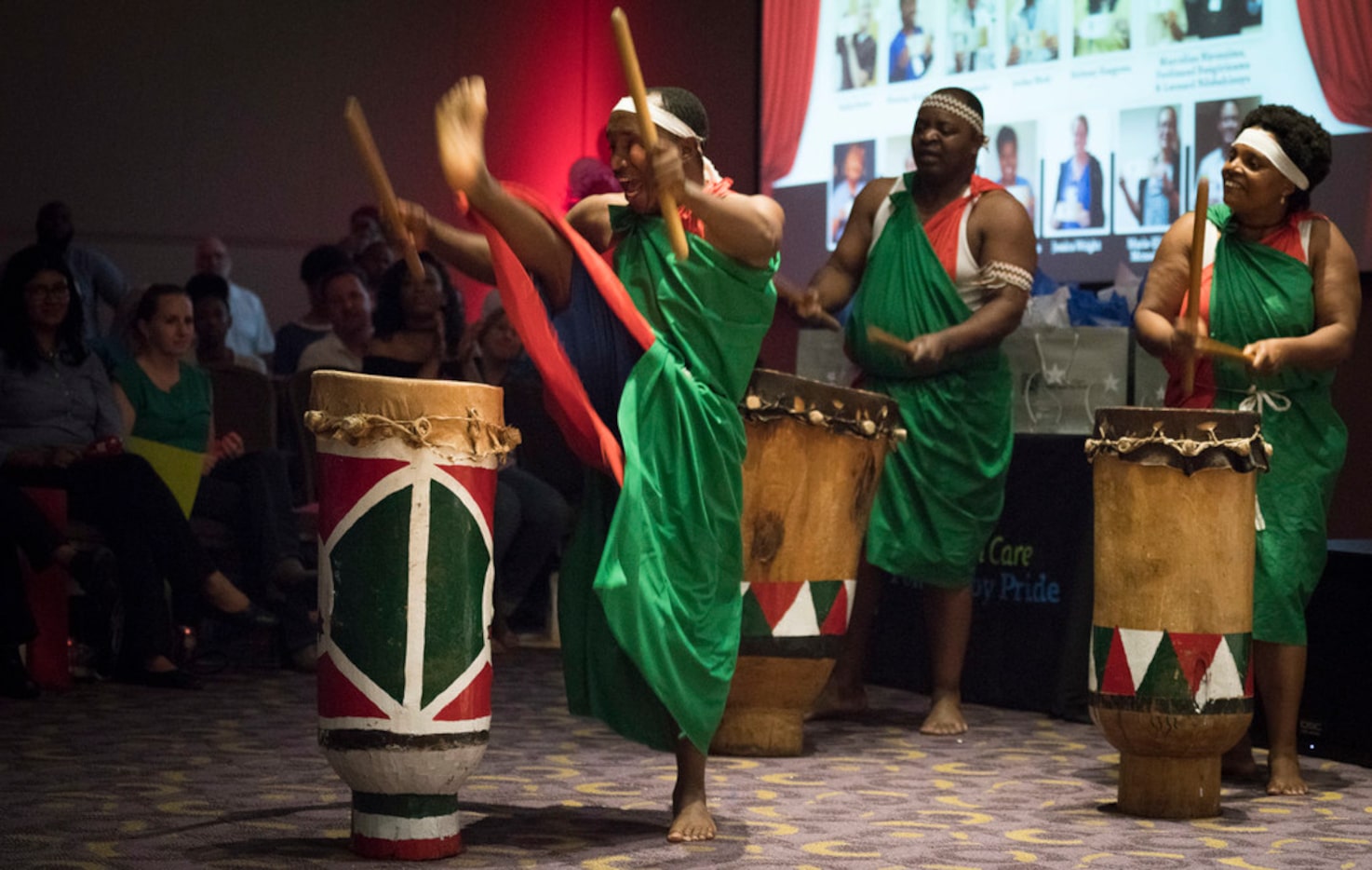 JPS Health Network transport operator Leonard Ndabahinuye, from left, kicks a leg over a...