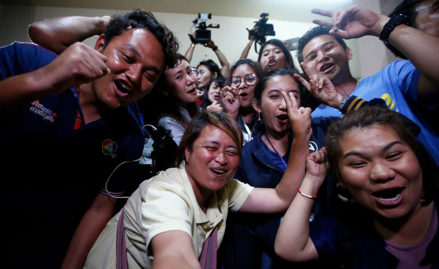 Thai media celebrate after evacuation in Chiang Rai as divers evacuated some of the 12 boys...