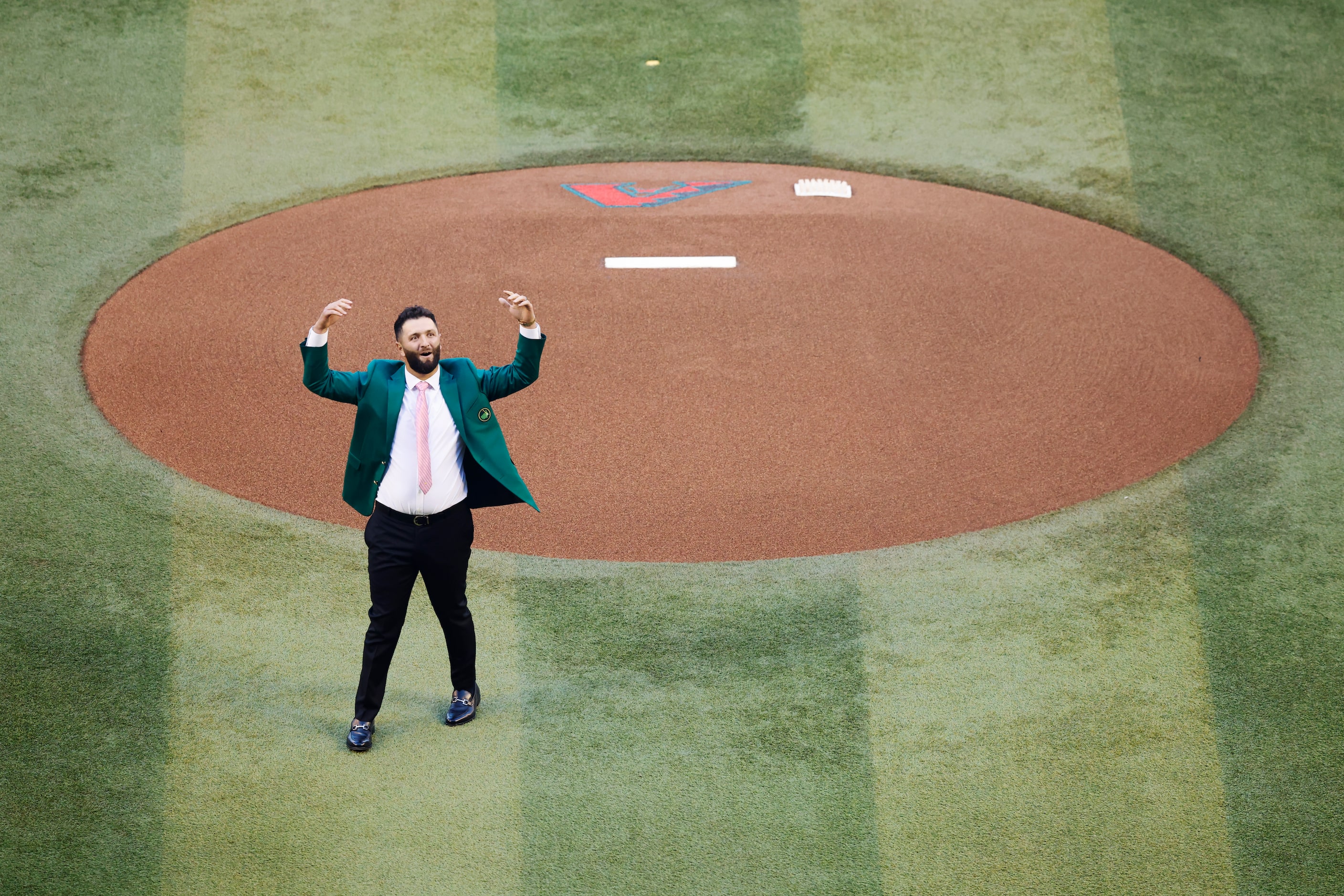 Masters Champion and Arizona State University alumnus Jon Rahm celebrates throwing the...