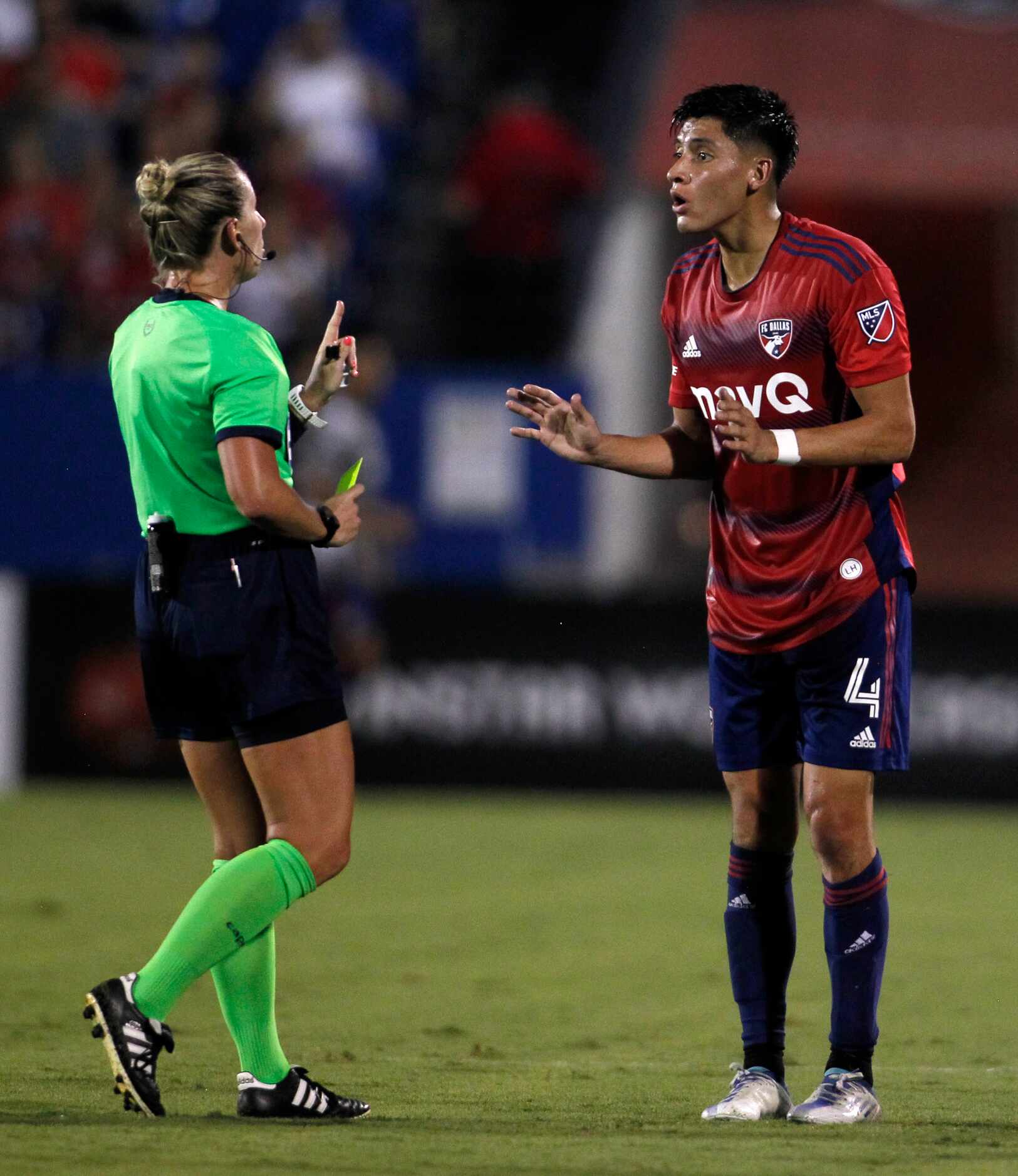 FC Dallas defender Marco Farfan (4) pleads his case to referee Tori Penso but to no avail as...