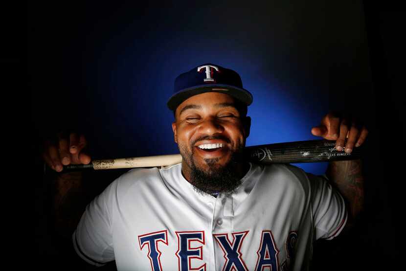 Texas Rangers first baseman Prince Fielder laughs at a comment from a teammate while...