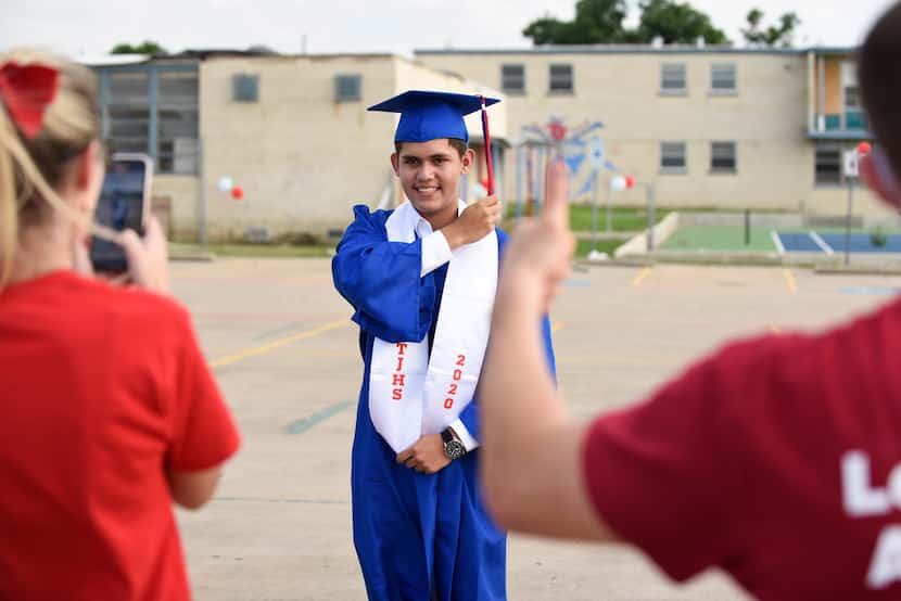 Senior Jaron Cardona got his picture taken while moving his tassel from right to left after...