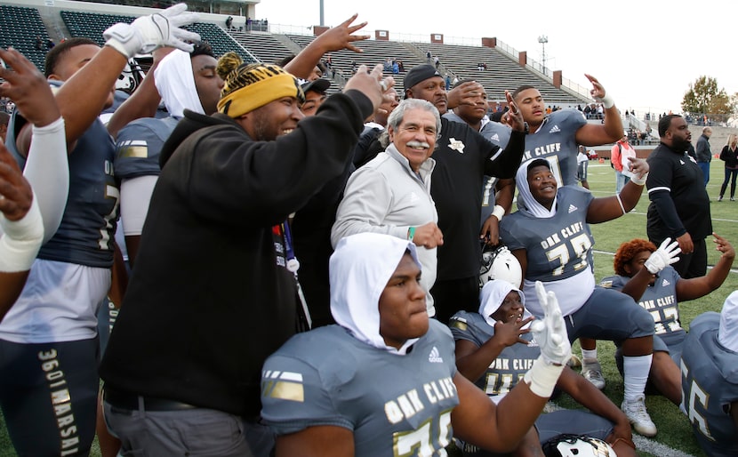 Dallas ISD superintendent Dr. Michael Hinojosa, center, sports a smile as he assembles to...