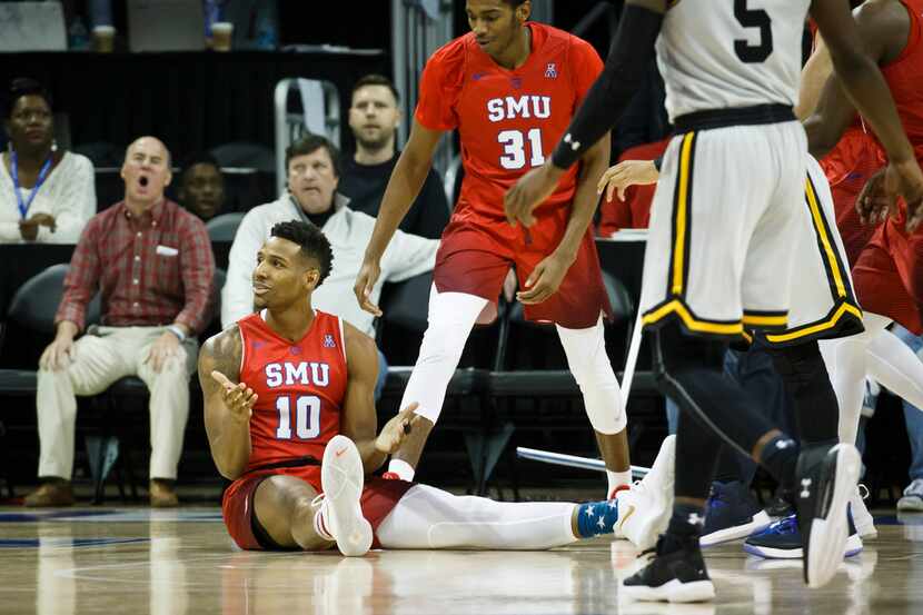 SMU guard Jarrey Foster (10) reacts after being called for a foul during the first half of...
