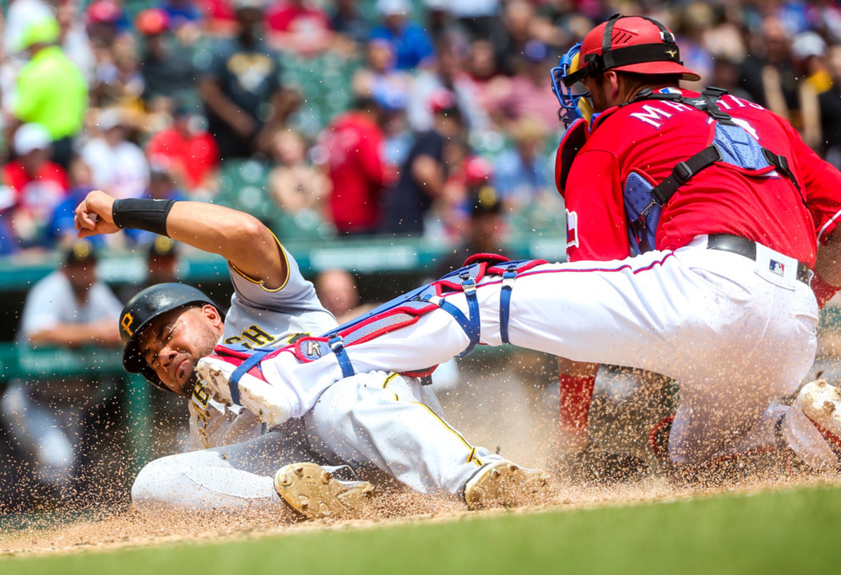 Texas Rangers catcher Jeff Mathis (2) tags out Pittsburgh Pirates center fielder Melky...