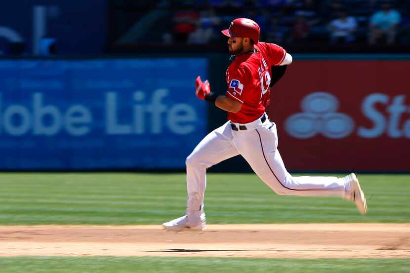 ARLINGTON, TX - APRIL 21: Joey Gallo #13 of the Texas Rangers rounds second base on his way...