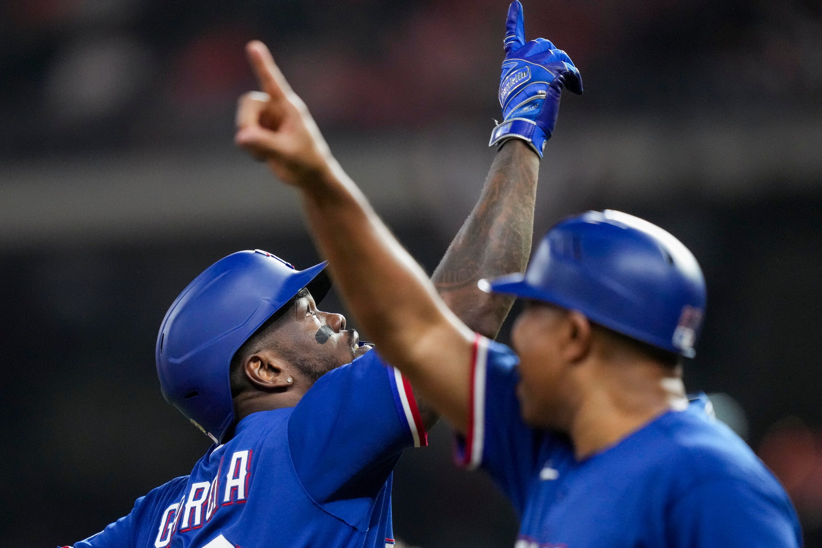 Texas Rangers right fielder Adolis Garcia (53) celebrates with third base coach Tony Beasley...