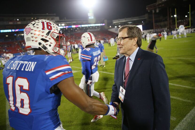 Southern Methodist Mustangs wide receiver Courtland Sutton (16) is greeted by SMU president...