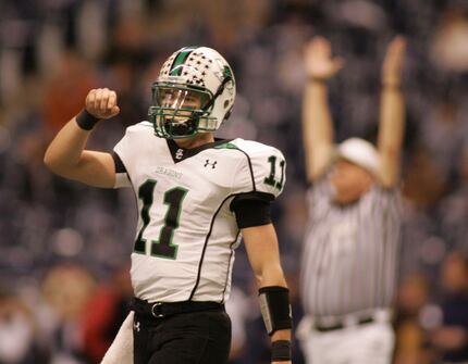 Riley Dodge, cq, pumps his fist to the side lines after throwing a late second quarter...