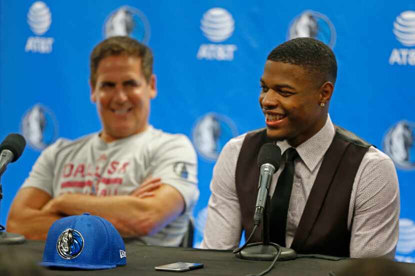 Mavericks first round pick Dennis Smith Jr. (right) answers questions next to owner Mark...