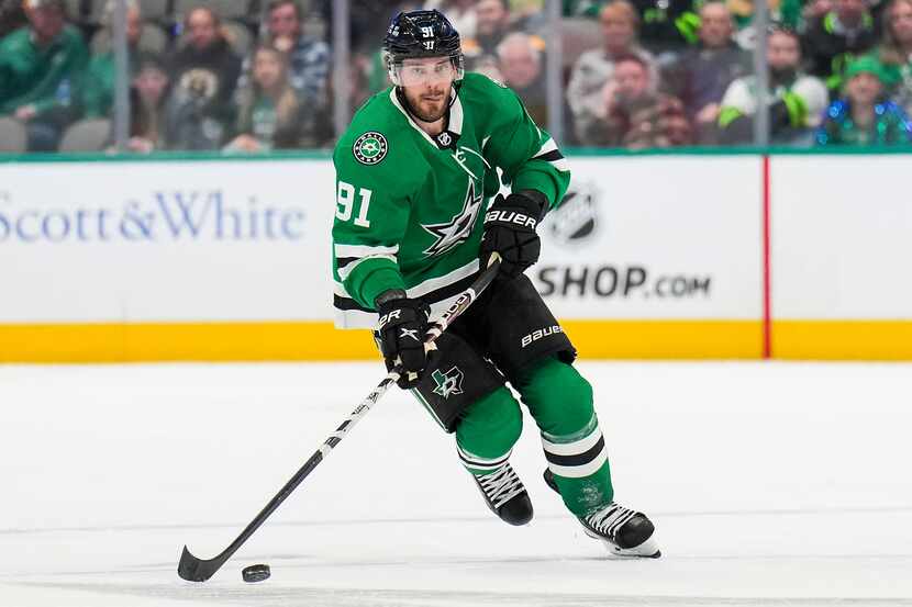 Dallas Stars center Tyler Seguin (91) controls the puck during the first period of an NHL...