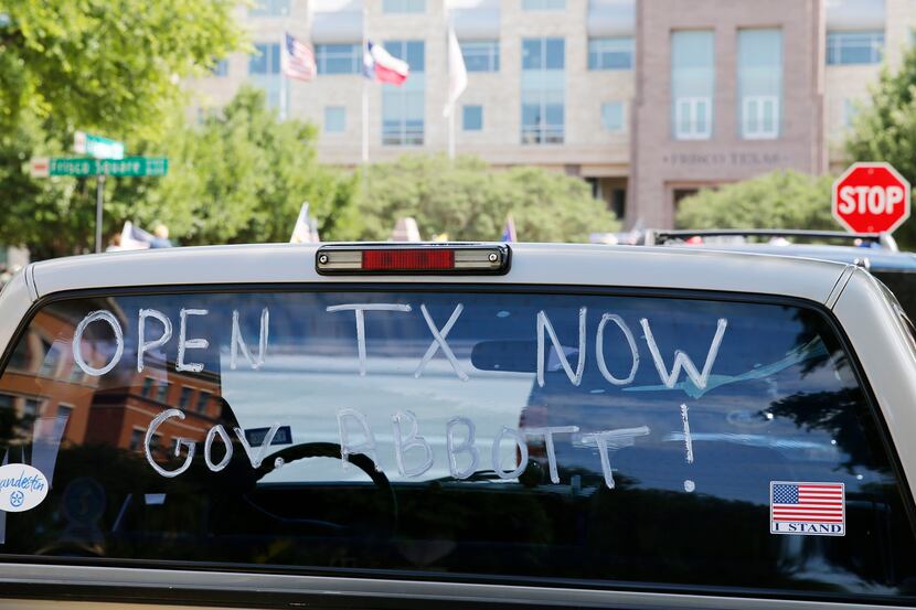 A message painted on a truck windshield promoted the reopening of Texas during a rally...