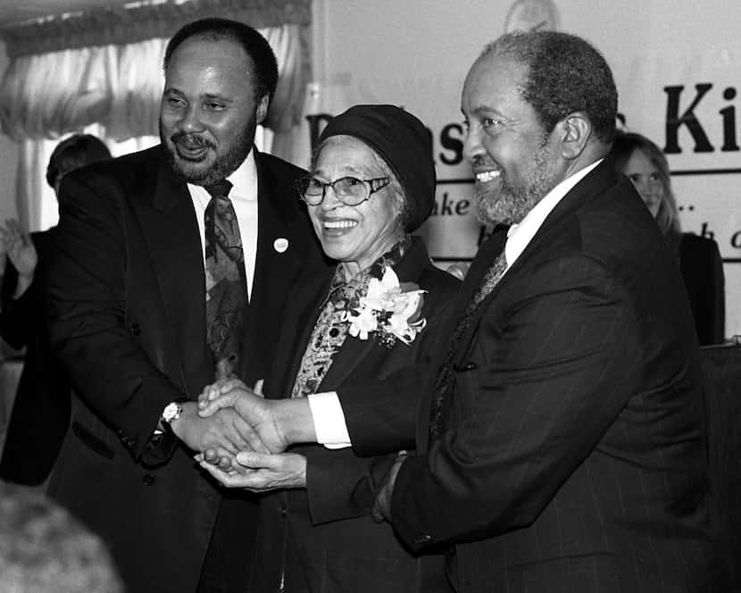 Martin Luther King III, Rosa Parks and Iman W. Deen Mohammed posed shaking hands after a...