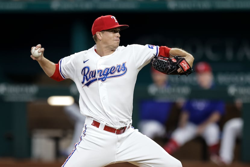 Texas Rangers starting pitcher Kyle Gibson (44) throws during the first inning of a baseball...