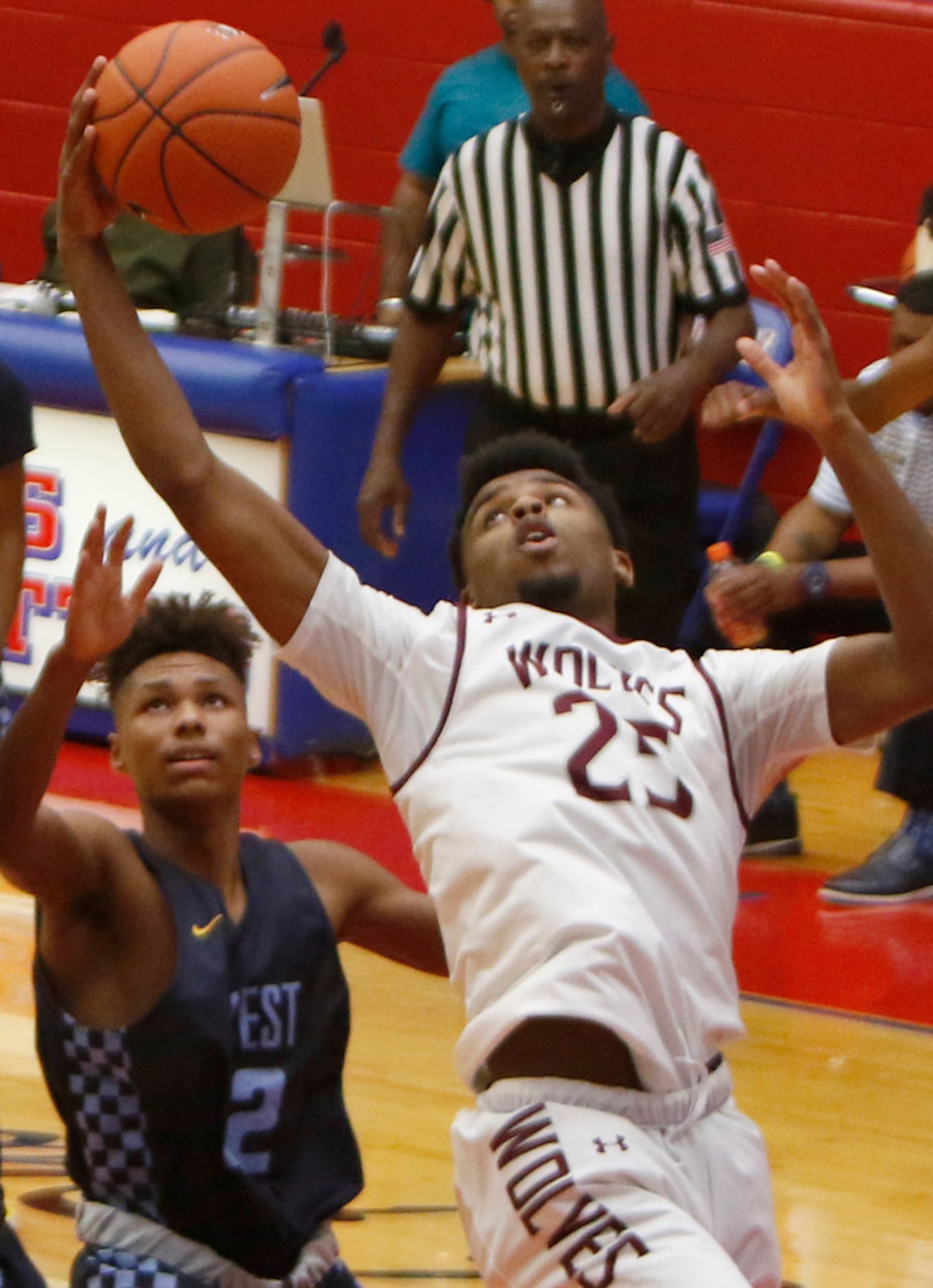 Mansfield Timberview junior Bryson Mitchell (25) reaches for a rebound over Putnam City...