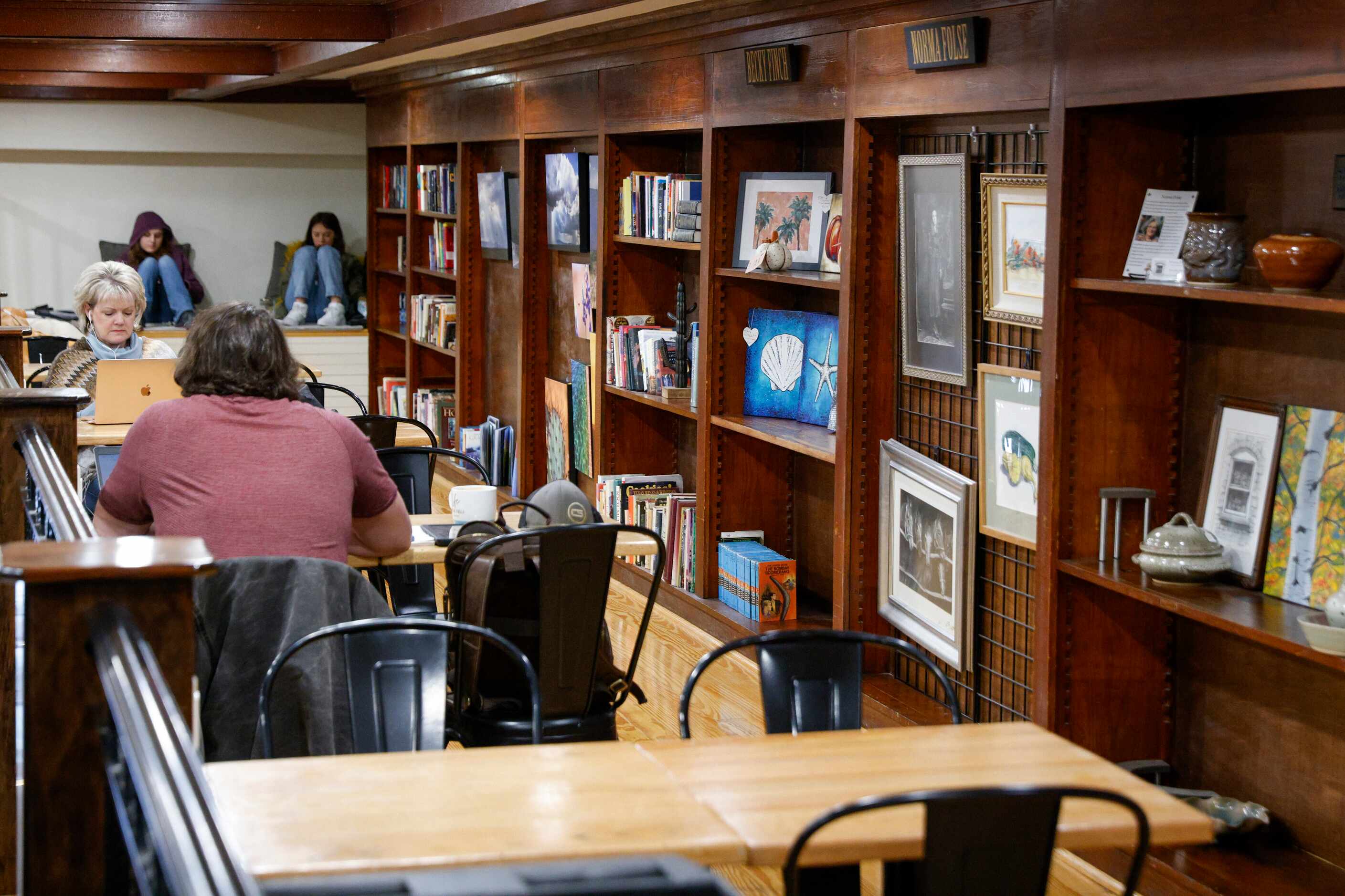 People sit upstairs at Overflow Coffee Co., Tuesday, Jan. 23, 2024, in Hillsboro, Texas.