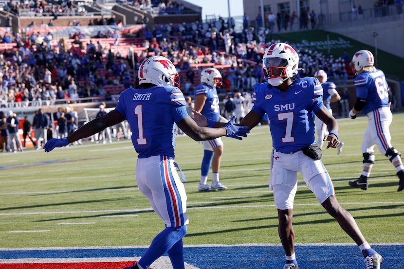 SMU running back Brashard Smith (1) celebrates with his teammate SMU quarterback Kevin...