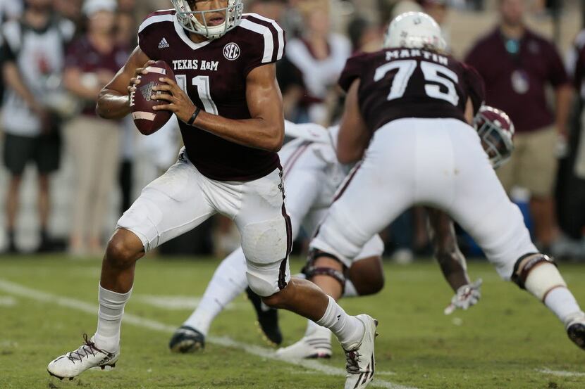 COLLEGE STATION, TX - OCTOBER 07:  Kellen Mond #11 of the Texas A&M Aggies scrambles out of...
