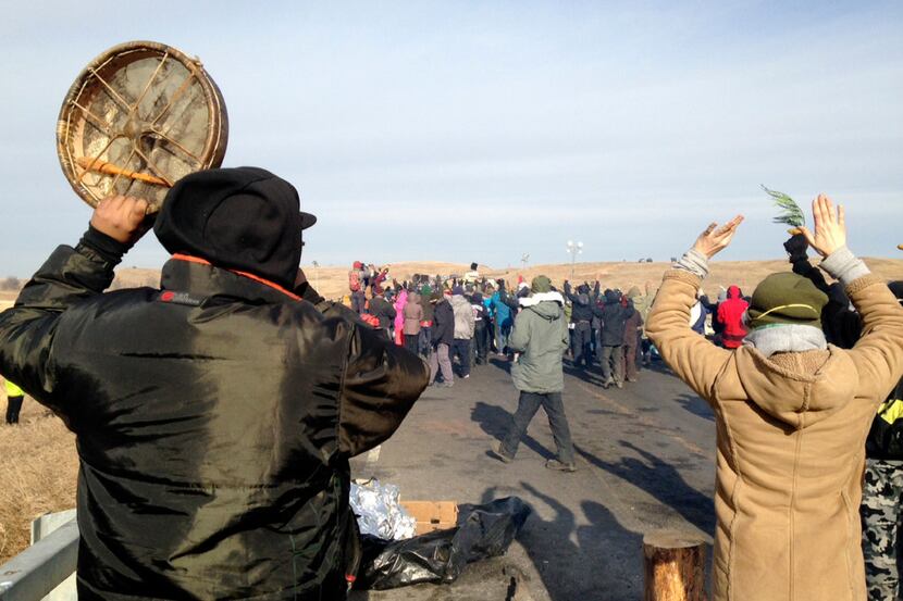 Protesters against the Dakota Access oil pipeline congregate Monday, Nov. 21, 2016, near...