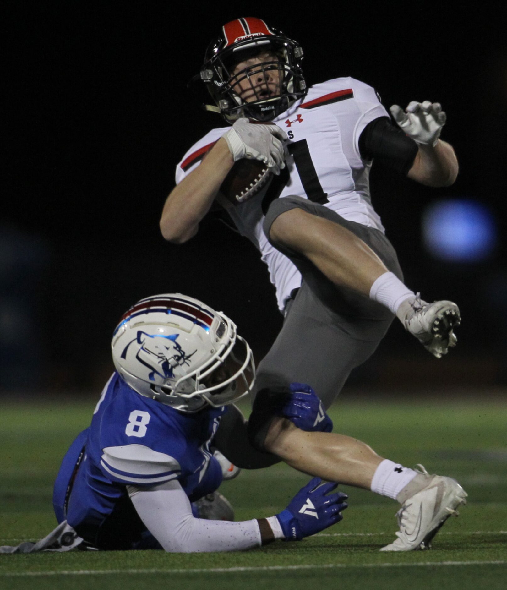 Duncanville defensive back Ladarius Thursby (8) tackles Killeen Harker Heights receiver Adam...