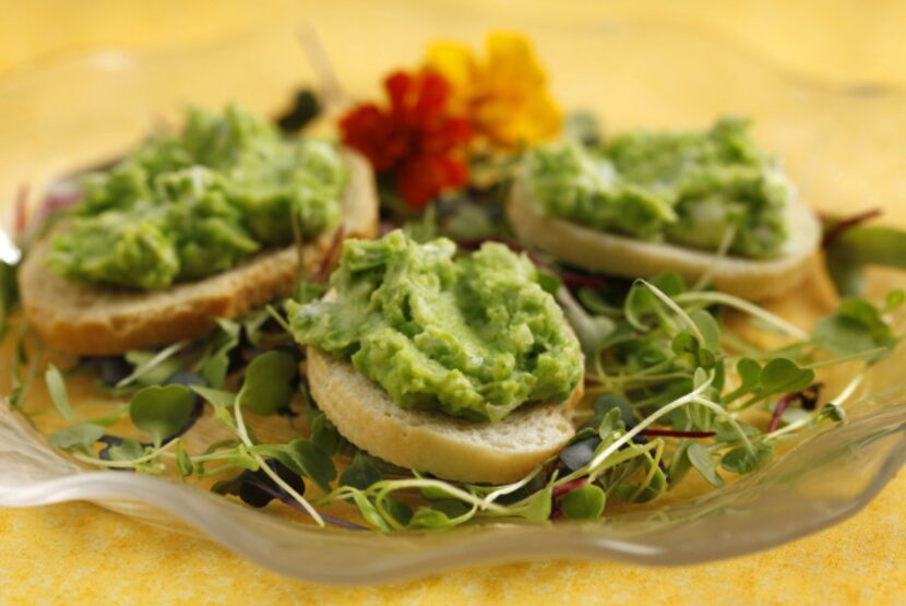 Green Pea Dip works as a dip -- or you can spread it on toasts set on a bed of micro greens.