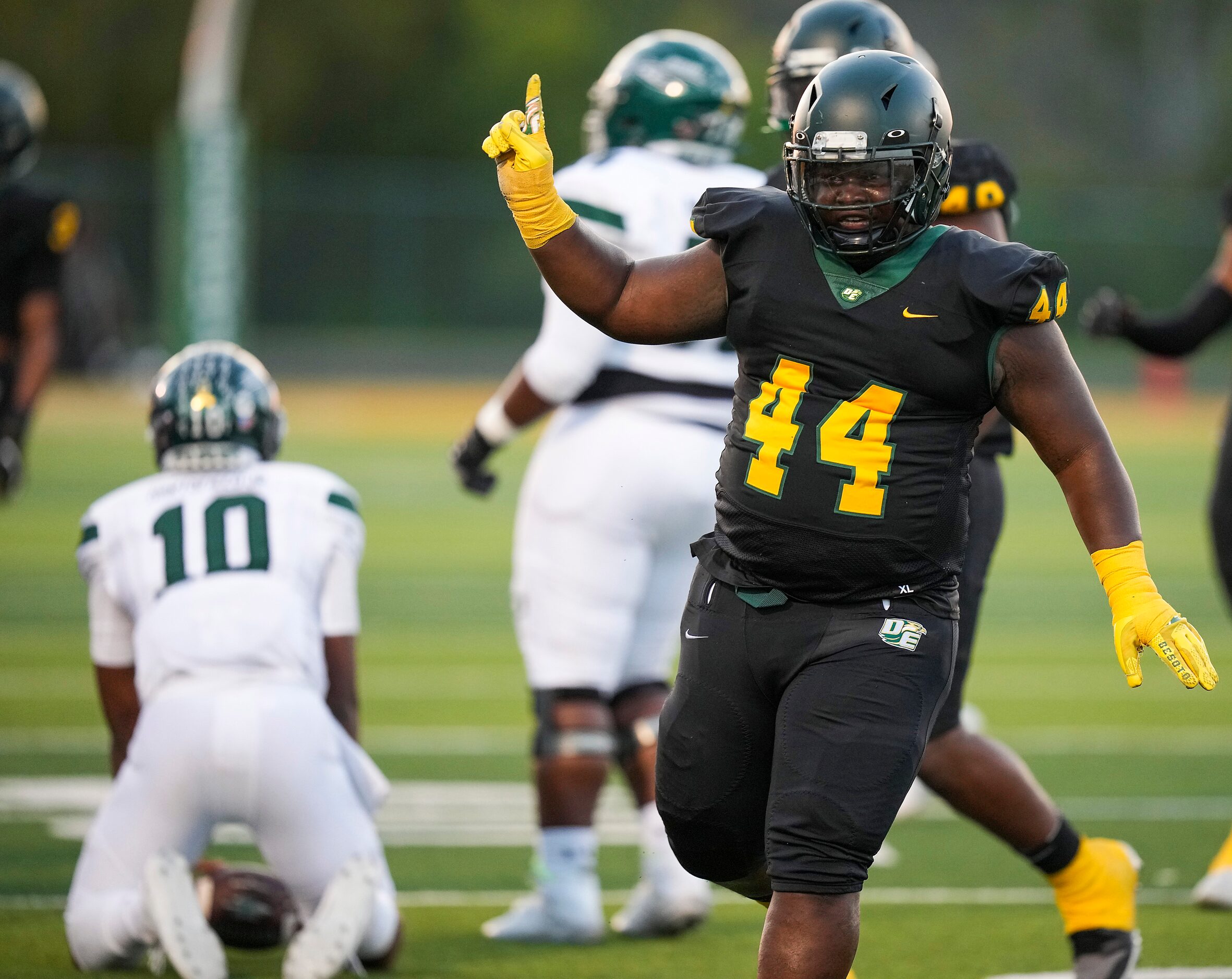 DeSoto defensive lineman Marshall Kirven (44)  celebrates after dropping Waxahachie...