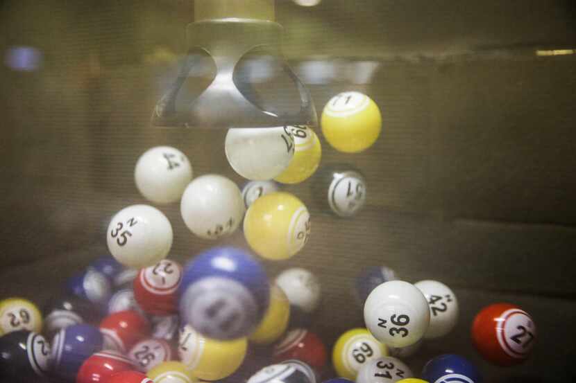 Bingo balls bounce in the tumbler during a round of bingo at Jackpot Bingo on Thursday,...