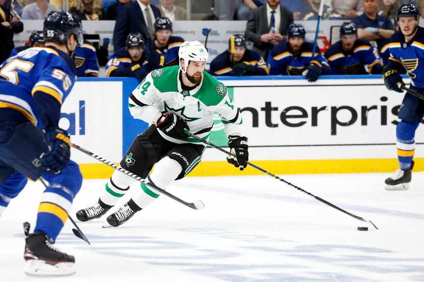 Dallas Stars left wing Jamie Benn (14) controls the puck against the St. Louis Blues during...