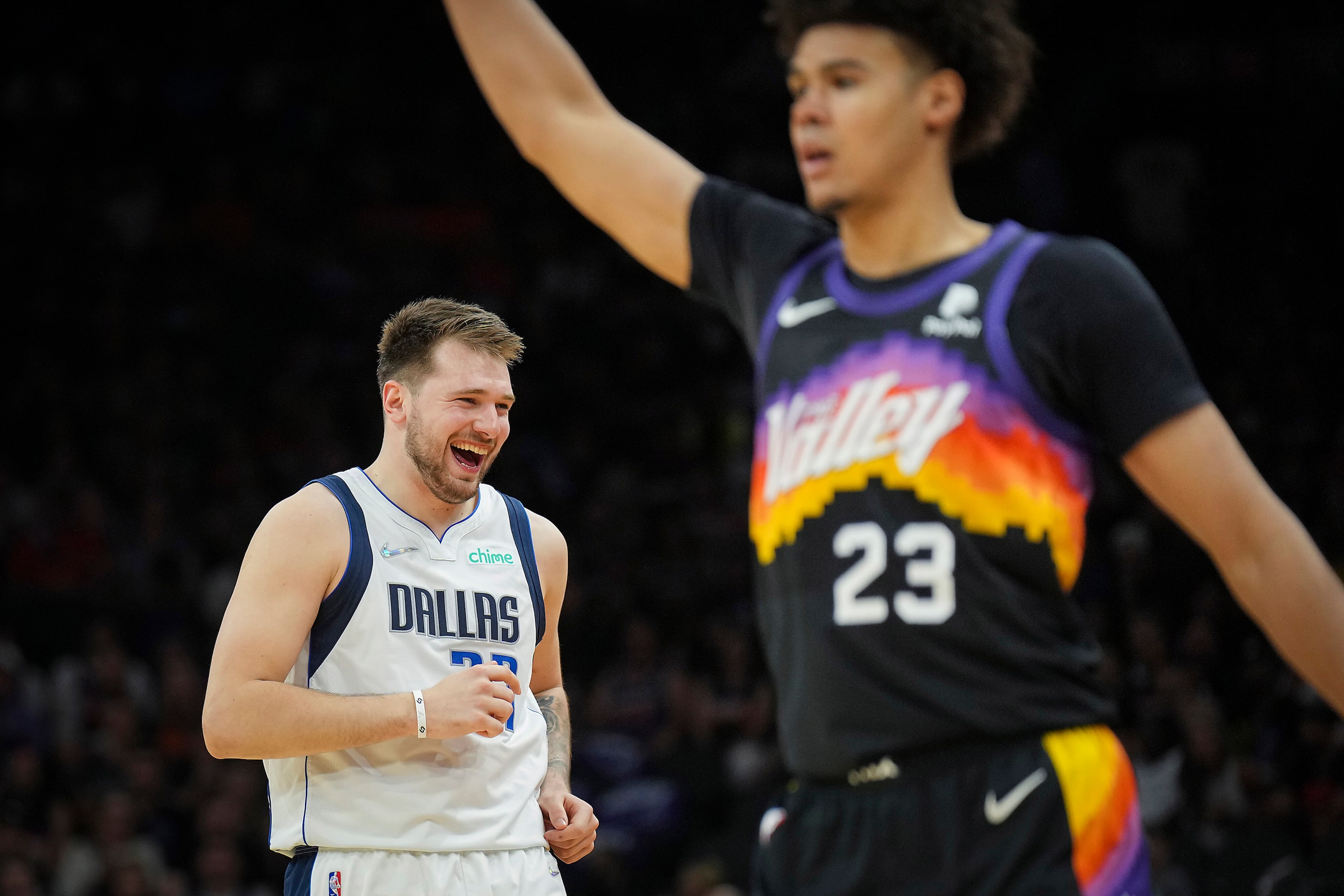 Dallas Mavericks guard Luka Doncic celebrates after hitting a 3-pointer past Phoenix Suns...