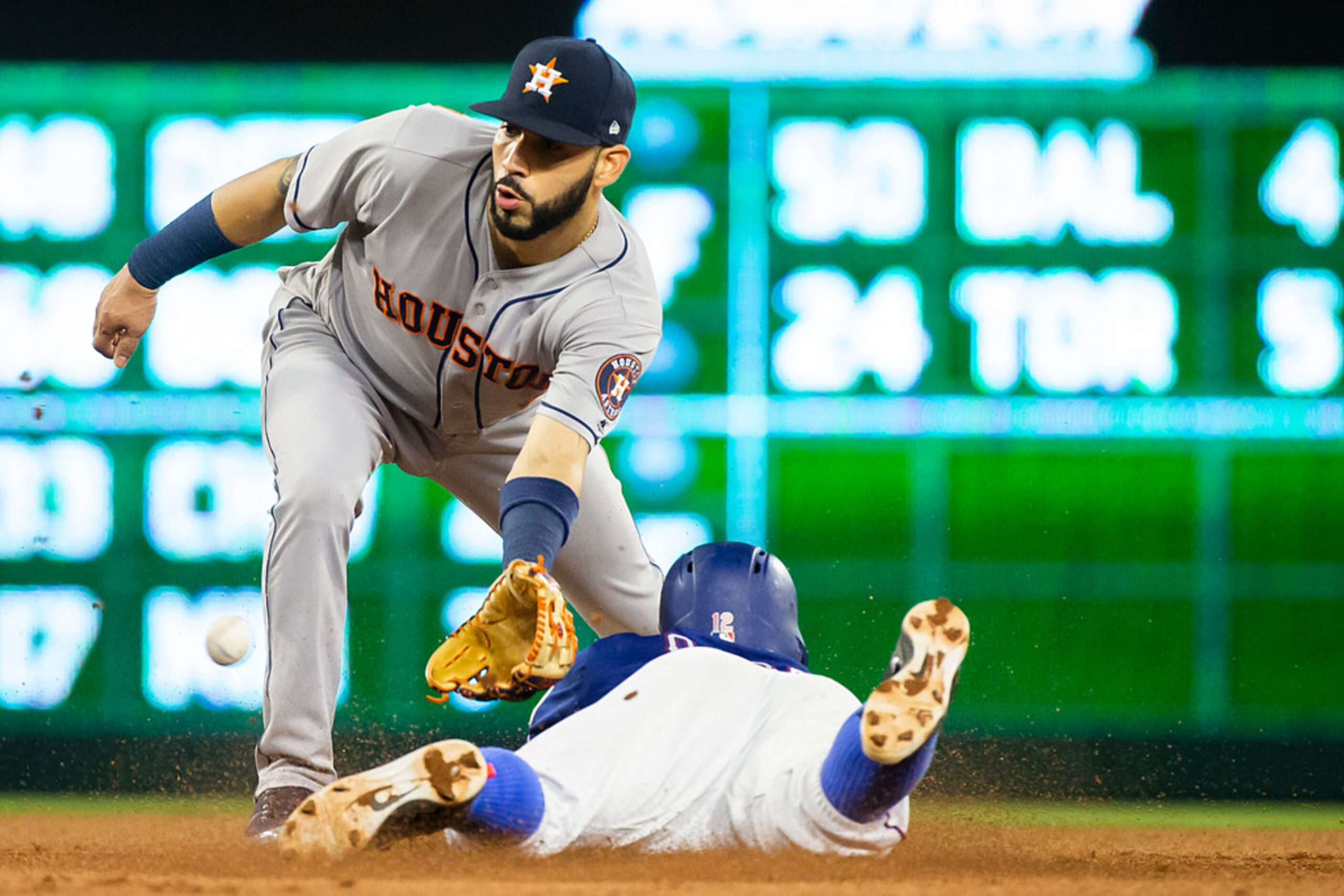 Texas Rangers second baseman Rougned Odor is out at second base as Houston Astros shortstop...