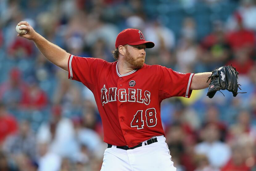 Tommy Hanson of the Los Angeles Angels of Anaheim pitches against the Texas Rangers at Angel...