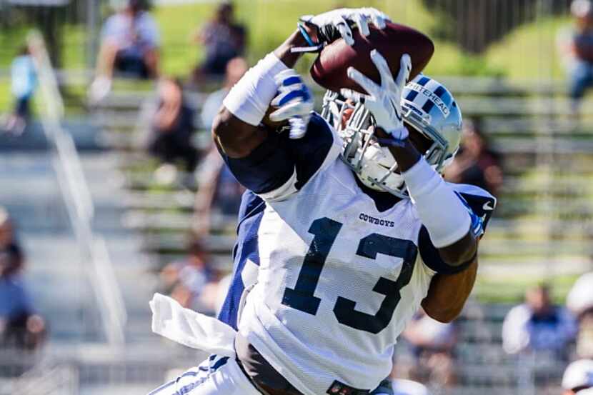 Dallas Cowboys wide receiver Lucky Whitehead (13) catches a pass as defensive back Jason...