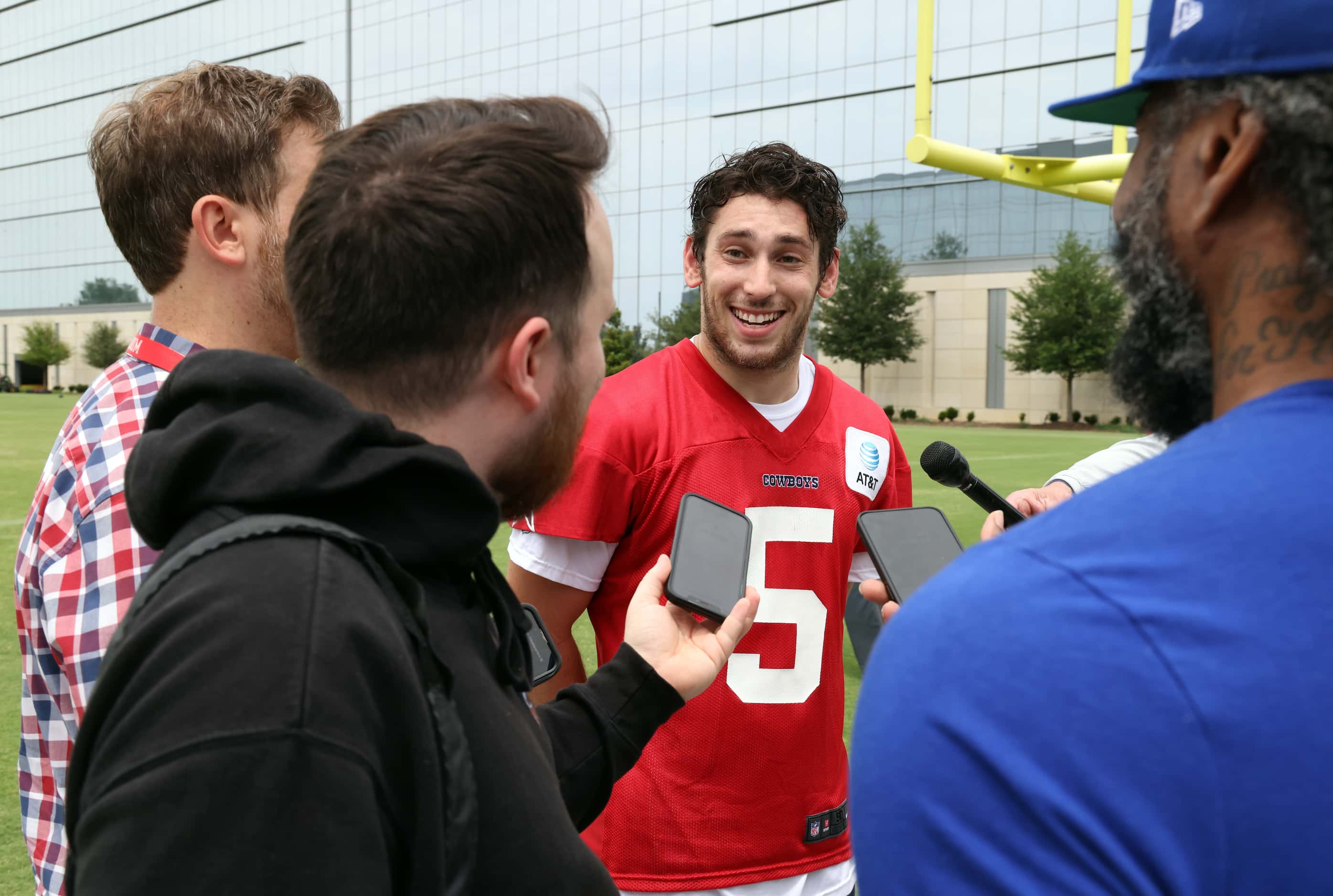 Dallas Cowboys quarterback Mike Hohensee (5) converses with media members after a practice...