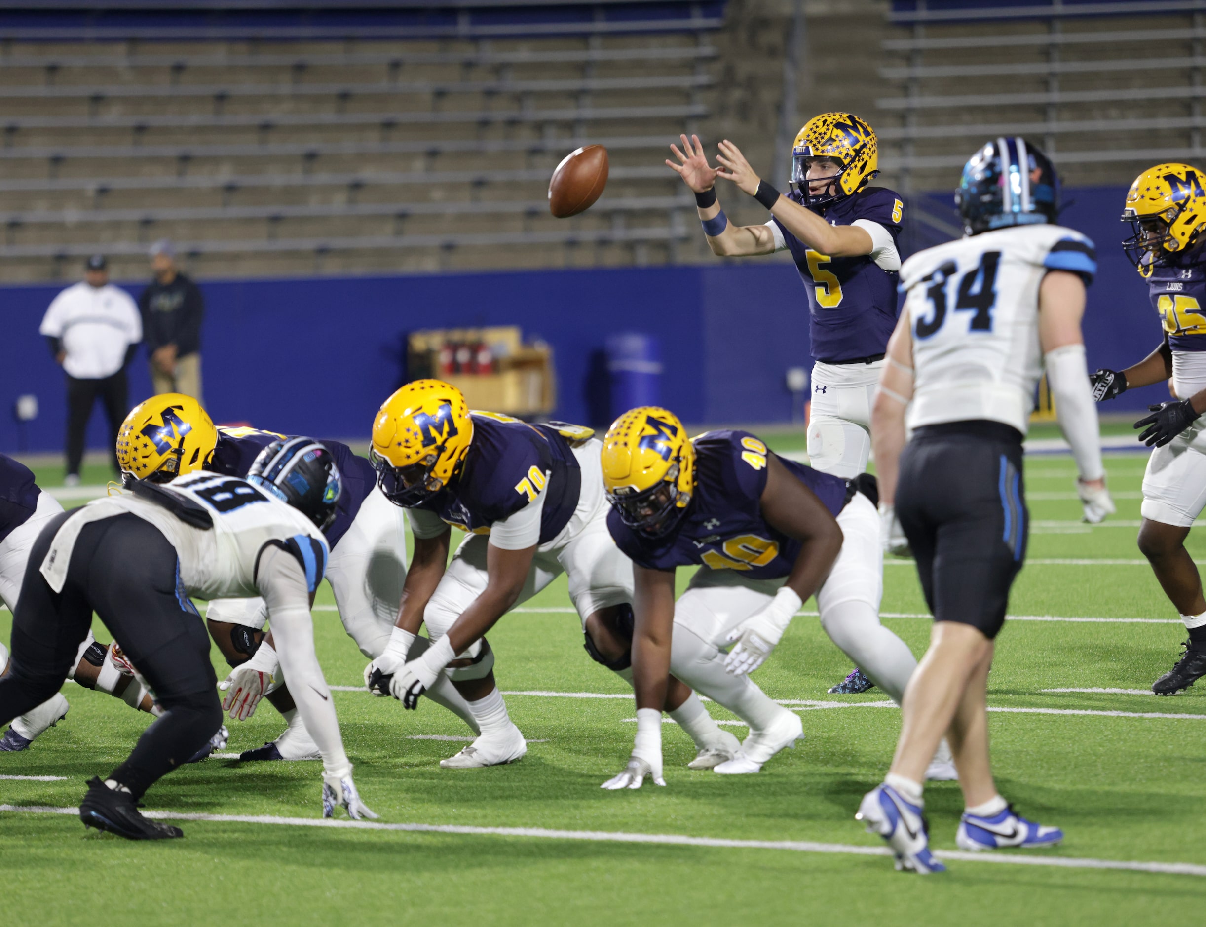 McKinney player #5 Jeremiah Daoud receives the snap during the Prosper Rock Hill High School...