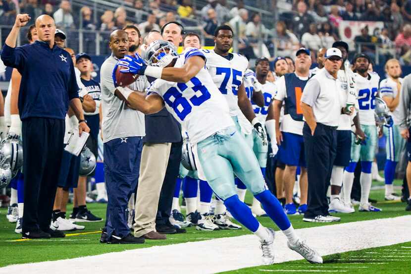 Dallas Cowboys wide receiver Terrance Williams tries to stay in bounds for a catch during...
