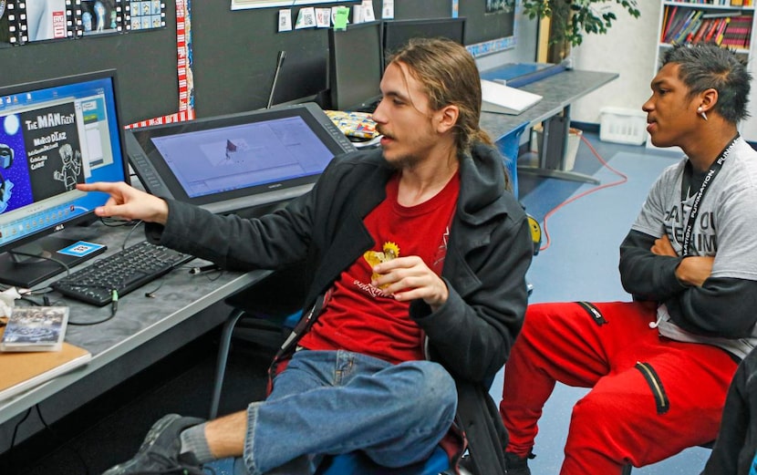 
Allen High School animation students Connor Reiersgord (left) and Reggie Robinson show one...