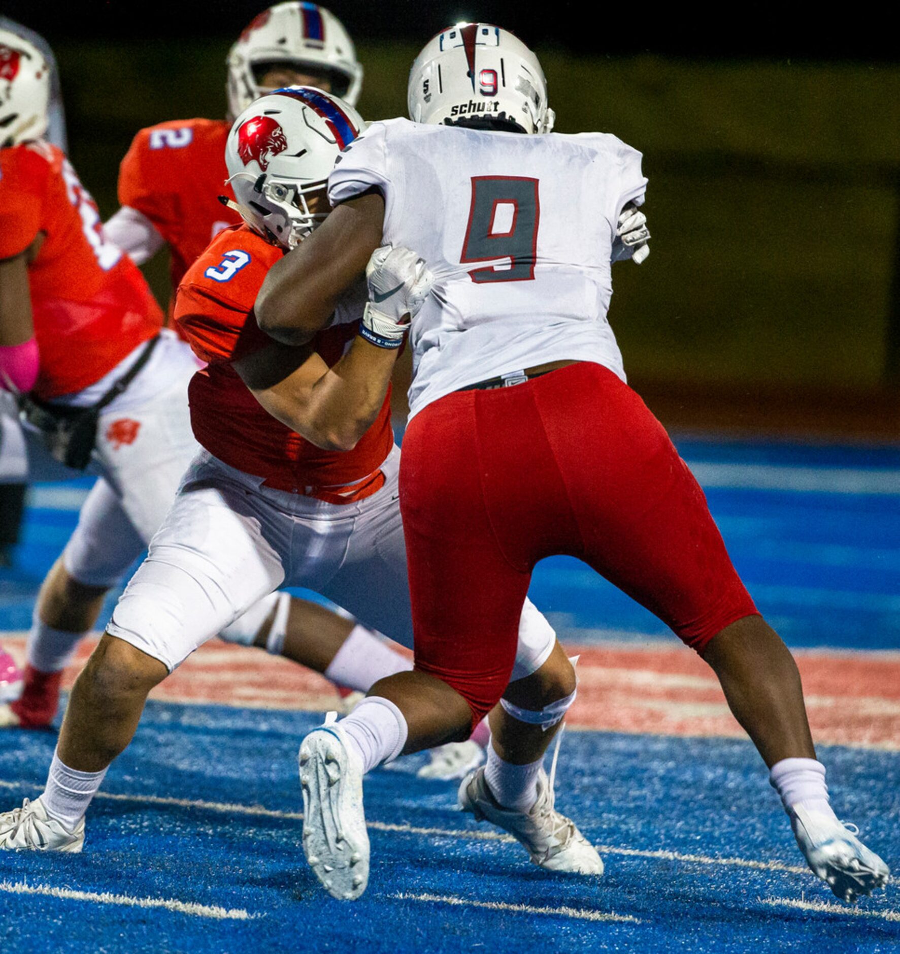 Parish Episcopal tight end Foster Malloy (3) and Bishop Dunne line backer Brennon Scott (9)...