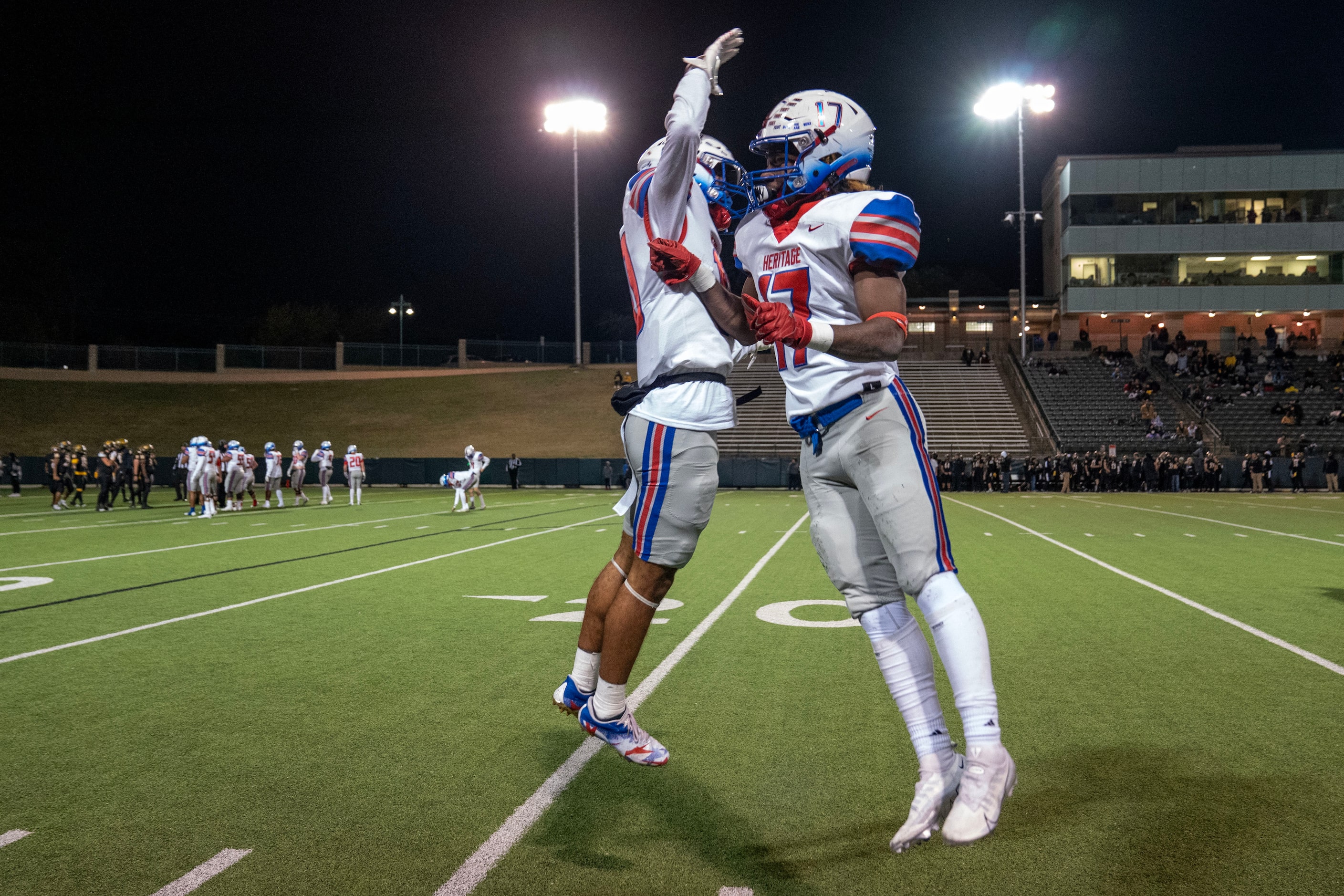 Midlothian Heritage senior running back Mason O’Neal (17) and senior wide receiver Tae...