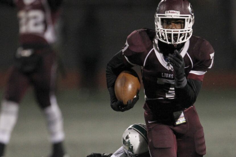 Ennis Lions free safety Jahshawn Johnson (7) is brought down behind by Mesquite Poteet...
