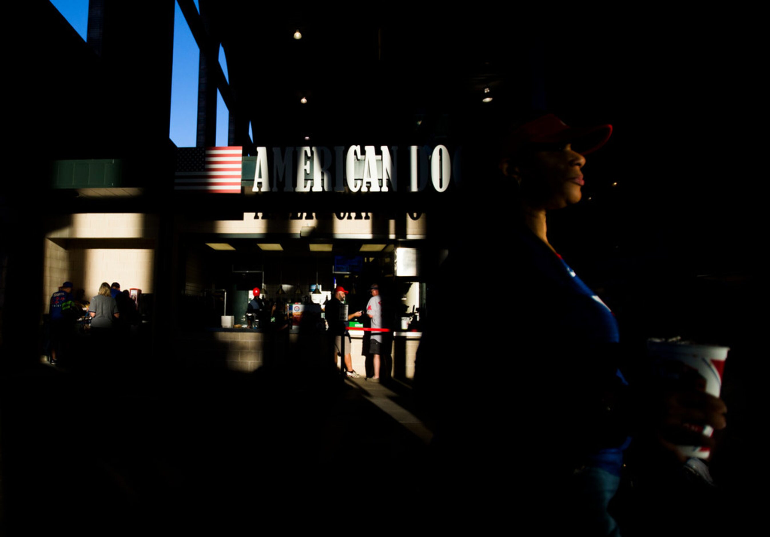 Baseball fans buy hotdogs and other concessions before an MLB game between the Boston Red...