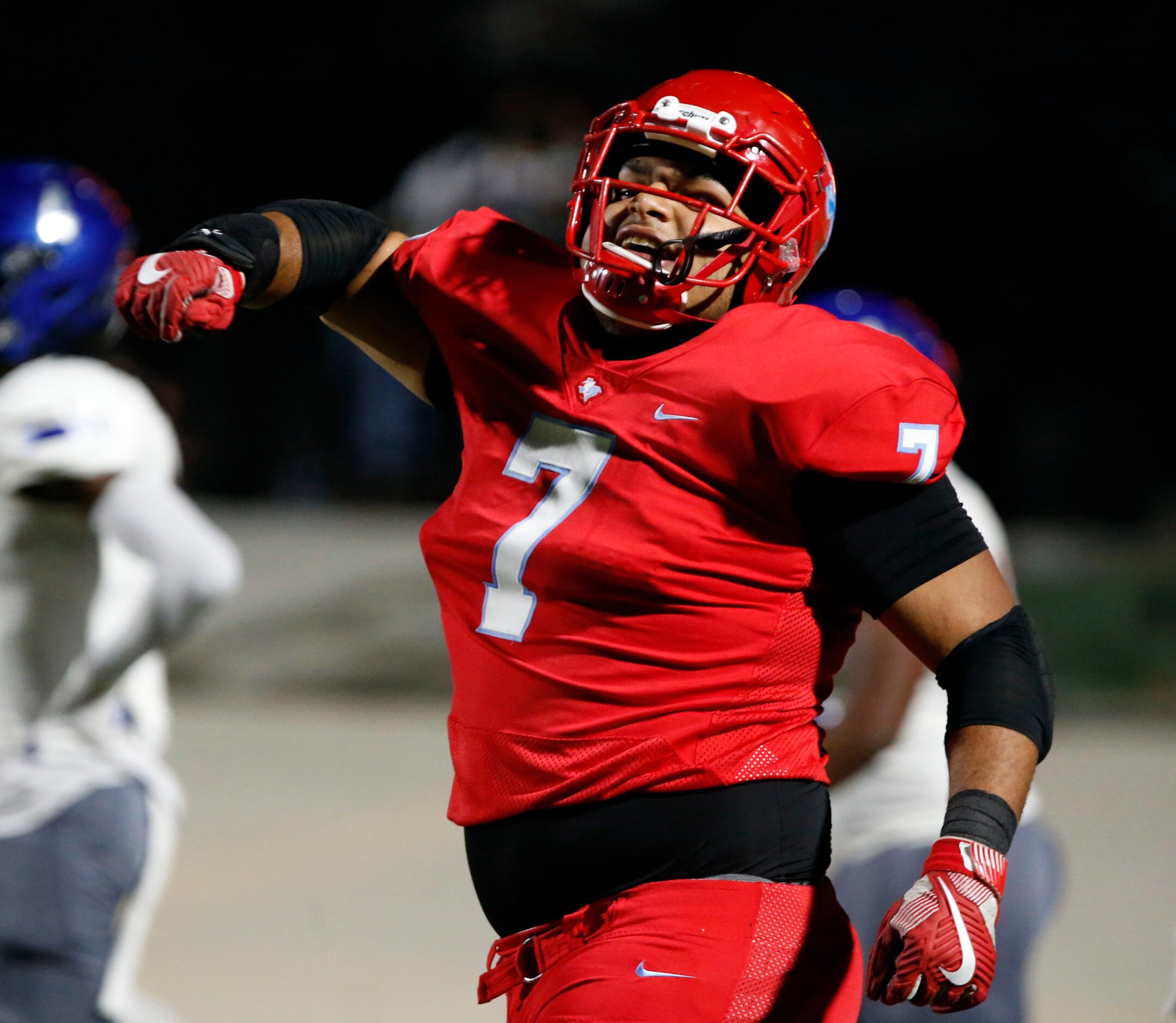 Skyline's Joe Elder (7) celebrates being interfered with during a two-point extra point...