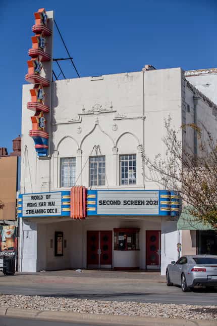 The marquee at the Texas Theatre touts the renovation plans.